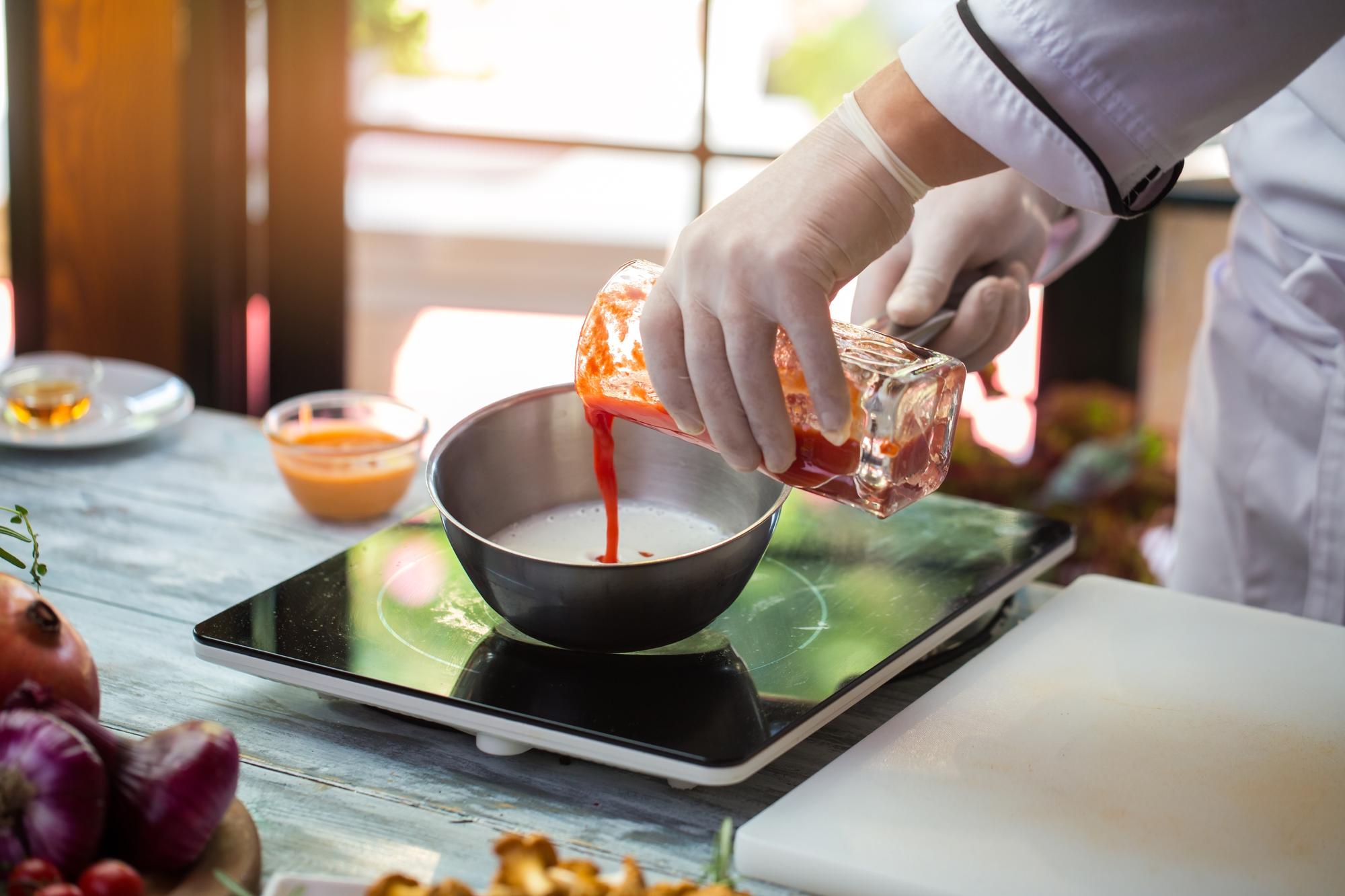 chef calibrating a modernist sauce with digital tools